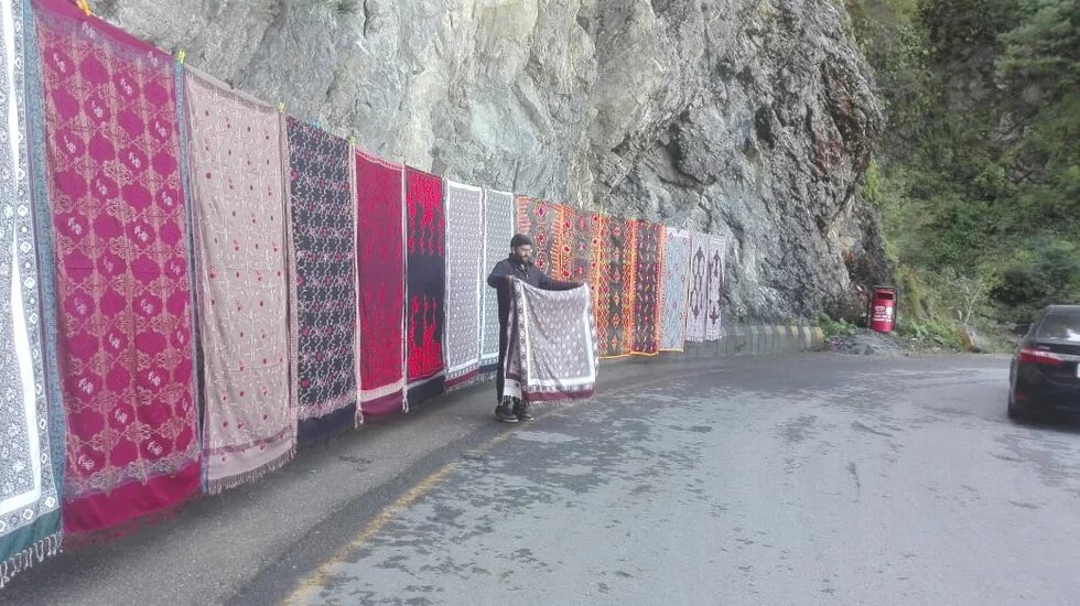 Abdul Wahab, a dweller of Nathiagali scenic resort in Pakistan North, is waiting for customers at his road side stall. Wahad has given up farming on his 4083.7 square feet farmland because of persistent damage of under cultivation crops by herds of wild boar.